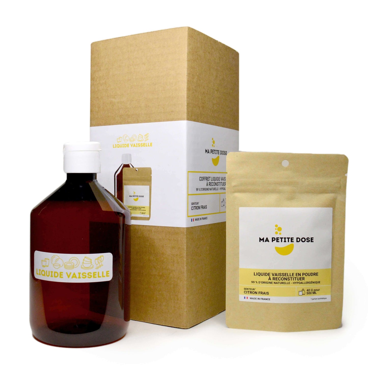Une bouteille d'huile essentielle de citron à côté d'une boîte en carton brun